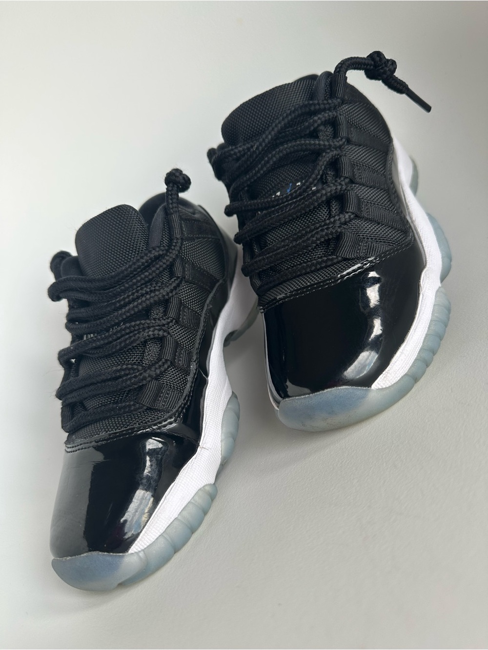 Jordan 11 low Kids Black Patent Low-Top Sneakers with White Midsole